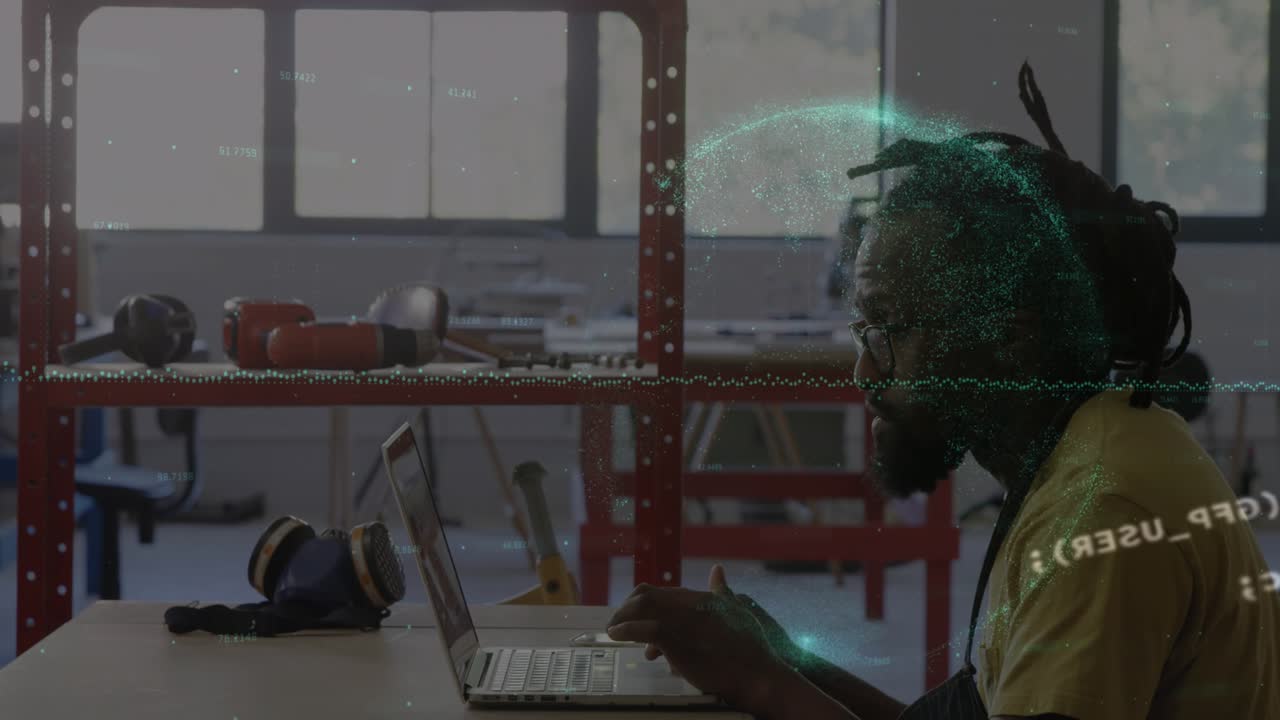 Animation of data processing over african american man using laptop