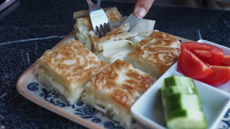 turkish cheese pastry with tomato and cucumber