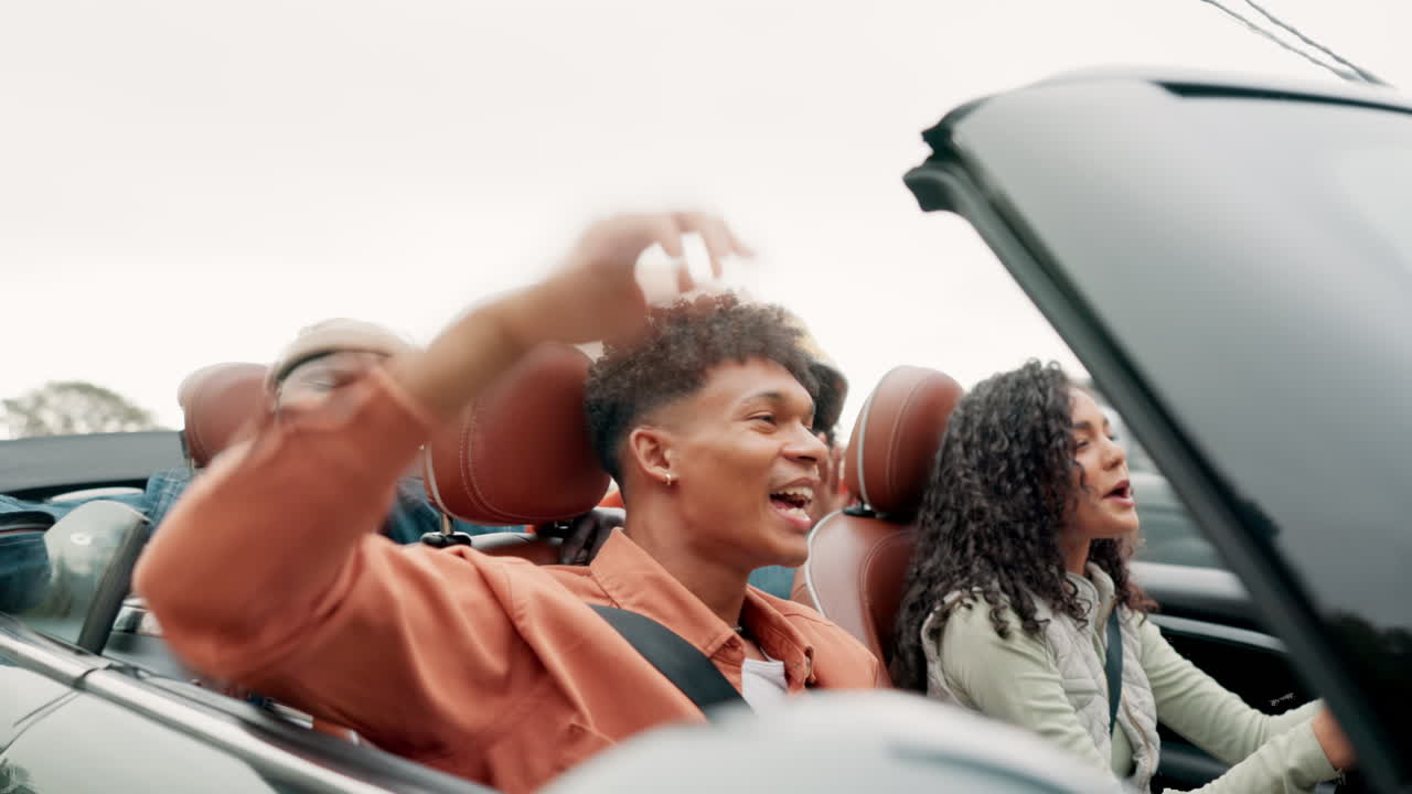 Friends on a road trip in a convertible