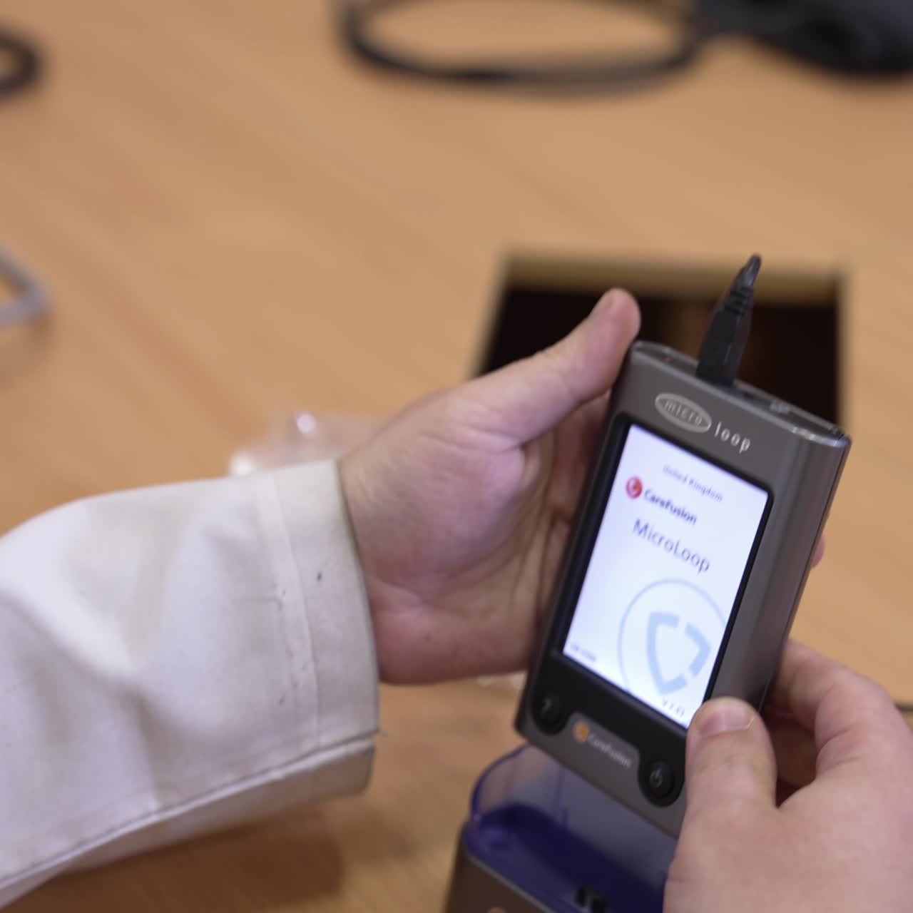 Doctor hands using equipment. Close up view of doctor using medical equipment