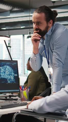 vertical video startup engineer and colleague with paraplegia brainstorming, working with ai