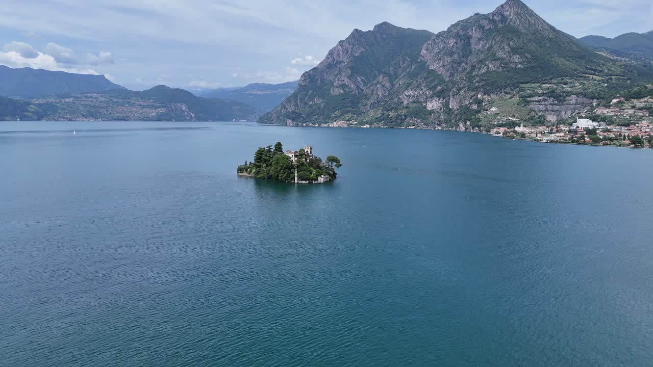 Island of Loreto north of Monte Isola , Lake Isola Panning drone aerial