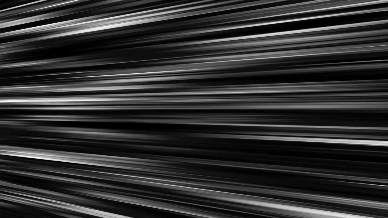Linee di velocità anime in bianco e nero che si muovono verso sinistra su sfondo nero, in un loop continuo.