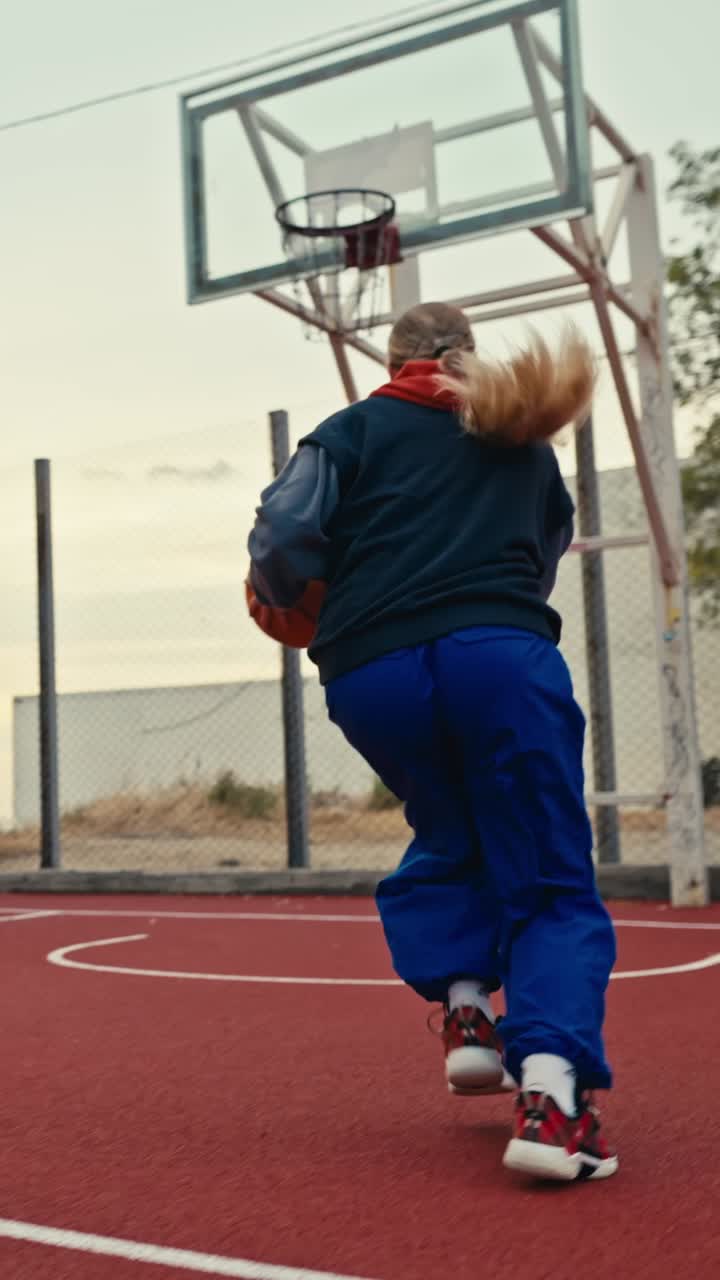 Women playing basketball on a court