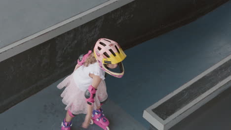 child rollerblading in skatepark