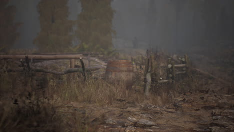 an old wood fence with a country field behind it