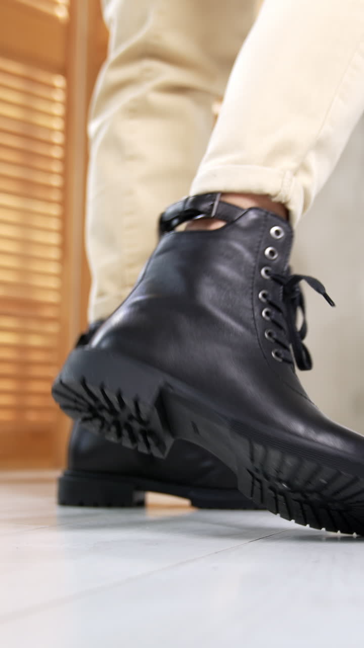 Woman stylish footwear showroom. Boutique lady shoes trying. Vertical video