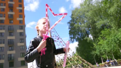 child blowing bubbles in a park