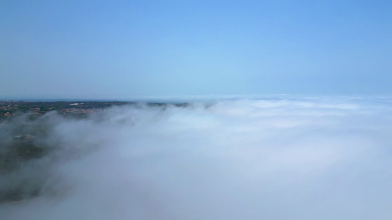 Flying over the fog that covers the landscape from Cascais,POrtugal