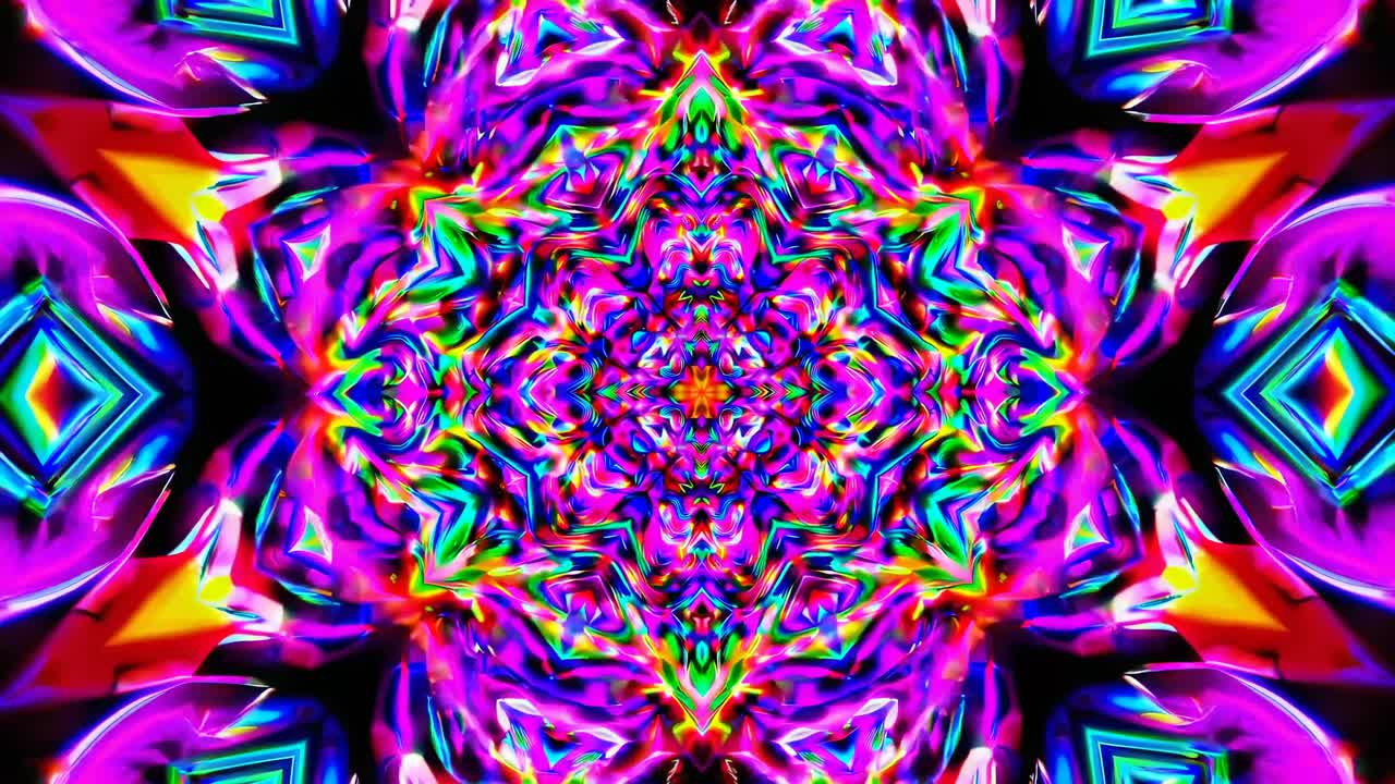 A kaleidoscopic video image with vibrant neon colors, viewed from a top-down angle