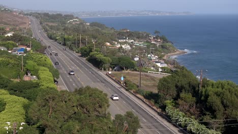 pacific coast highway, neighborhood and ocean view - descending aerial view