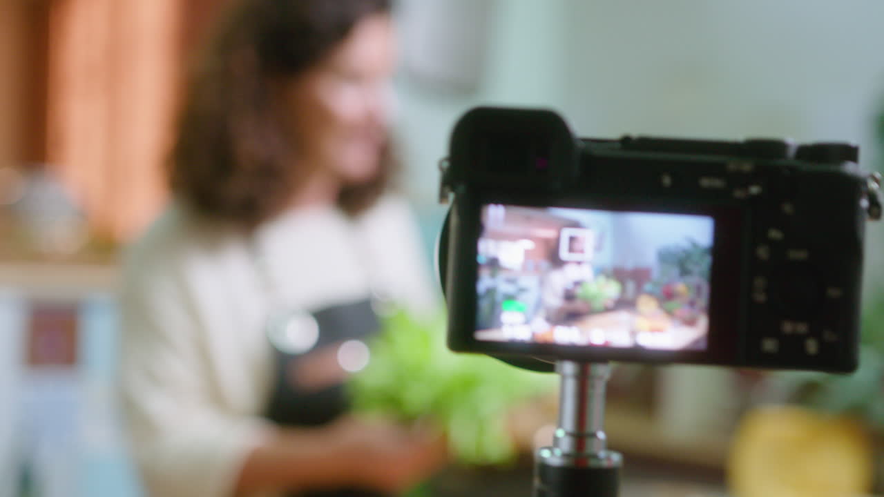 Woman recording cooking video