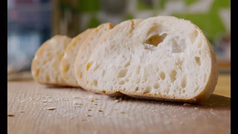 sliced fresh bread on a wooden cutting board