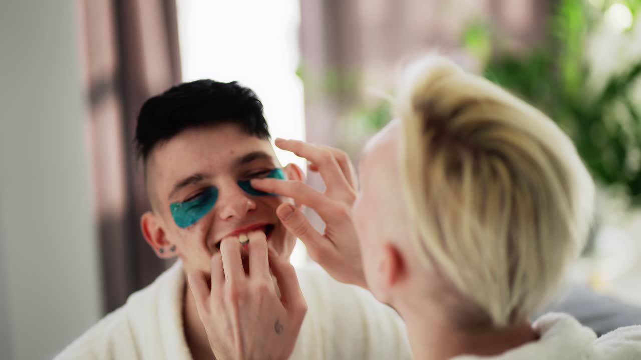 Gay couple having fun using eyes patches