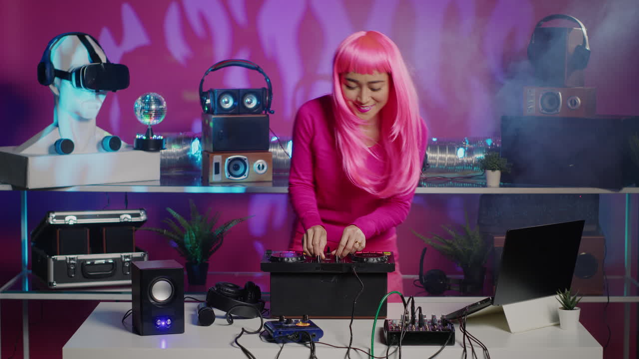 Woman DJ mixing music at turntable