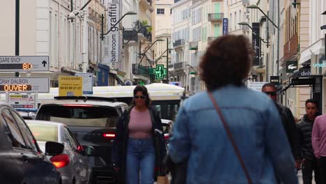 traffic along famous shopping street rue d'antibes in cannes city, france. static shot