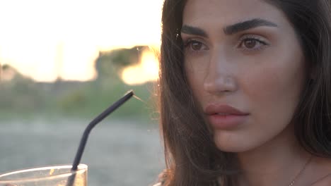 Woman-on-the-beach-stares-off-into-the