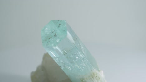 light blue hexagonal crystal rotating