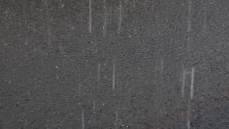 heavy rain, raindrops on the surface of the river with an irregular pattern