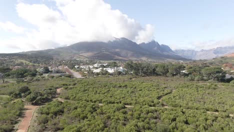 Rough-Roads-And-Small-Town-By-The-Wilderness---aerial-shot