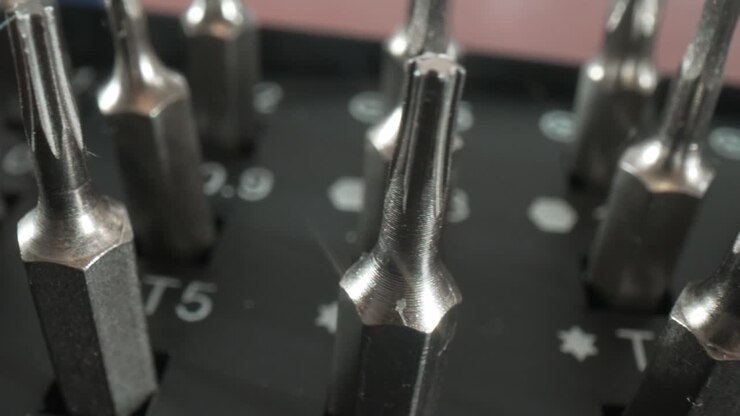 Tools bit set for repair of smartphones and computer equipment close-up.