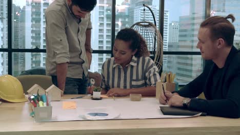 Creative-business-people-group-having-conversation-at-office-desk-in-workplace.