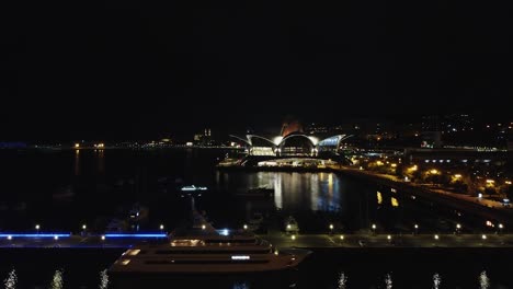 night aerial rises over yacht moored on baku azerbaijan caspian sea