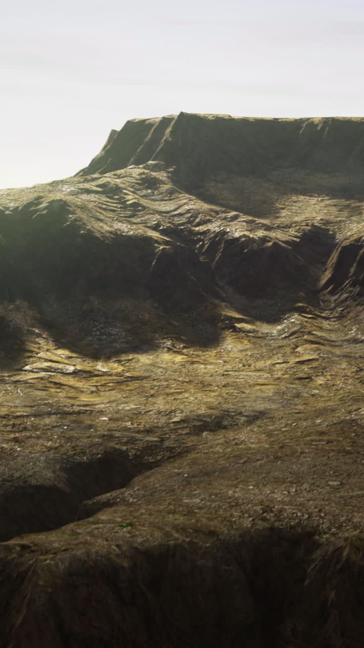 Dramatic landscape showing rocky cliffs and rugged terrain in a remote area