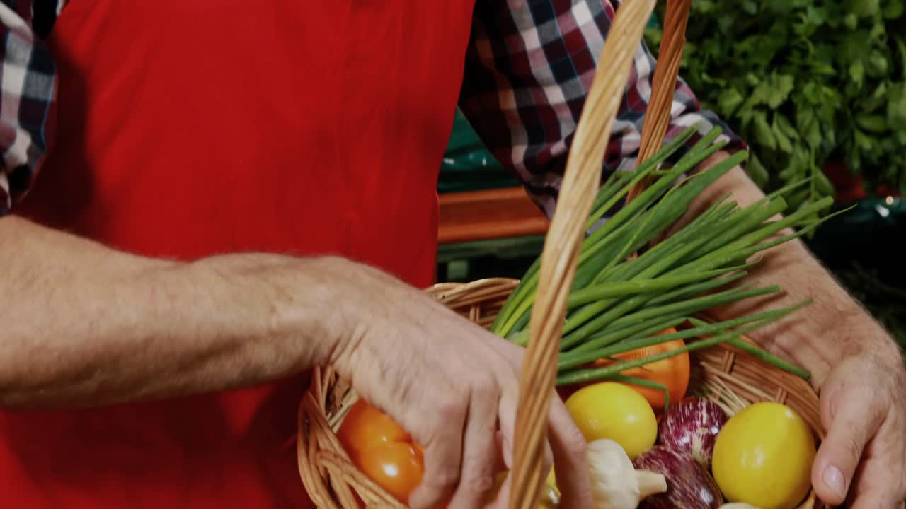 Vendor placing produce in basket, camera pulling back, smiling, graphics showing goods for retail