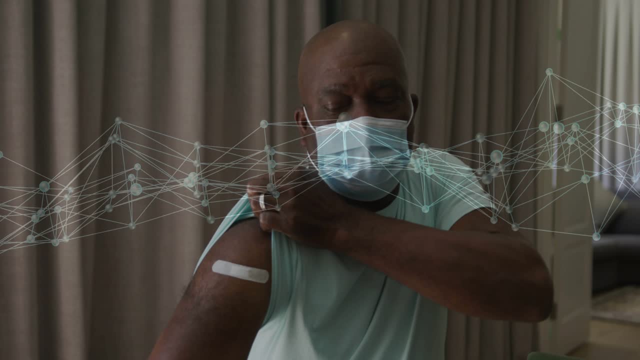 Man adjusting sleeve and pressing patch after shot, network overlay tracing site to monitor health