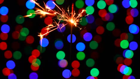 a close-up macro shot of one burning new year sparkler.