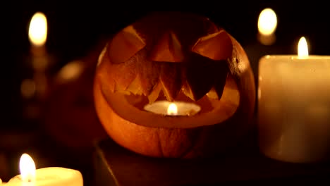 smiling halloween pumpkin in candlelight shines at night as a looped lantern