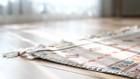 close-up of a colorful rug on a wooden floor