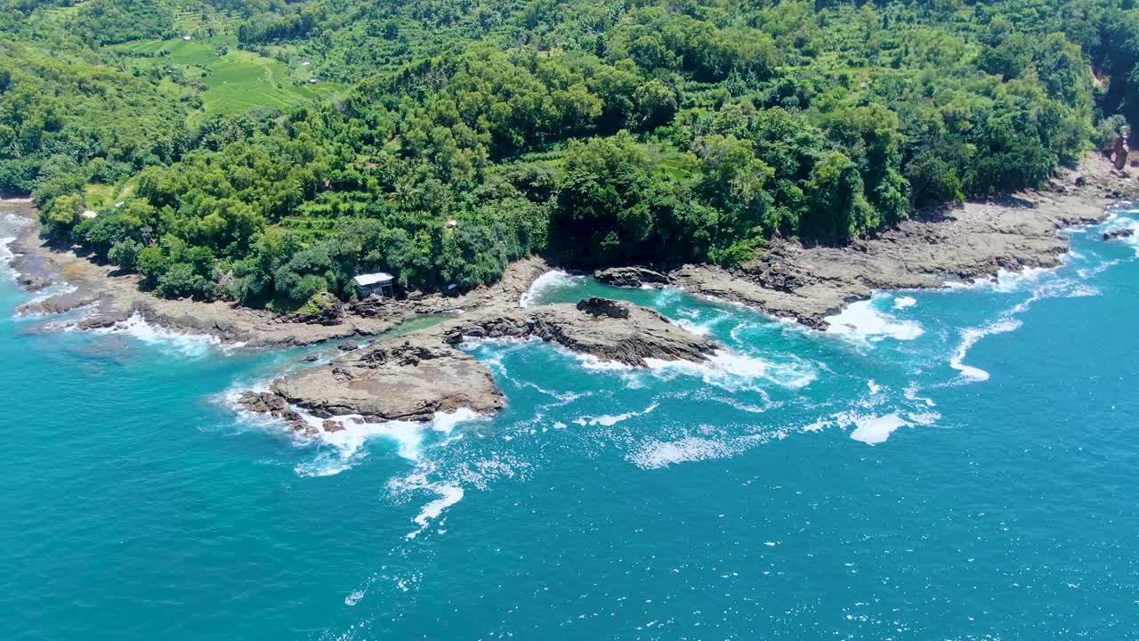 Premium stock video - Volcanic rocks on tropical wediombo coast on java ...