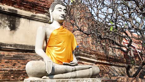 buddha statue with orange robe in ayutthaya