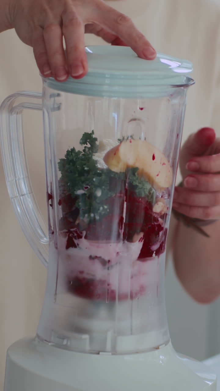 Woman Blending Fruits for Smoothie