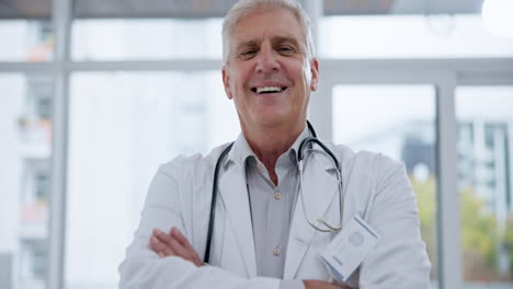 man, face and doctor with arms crossed in hospital