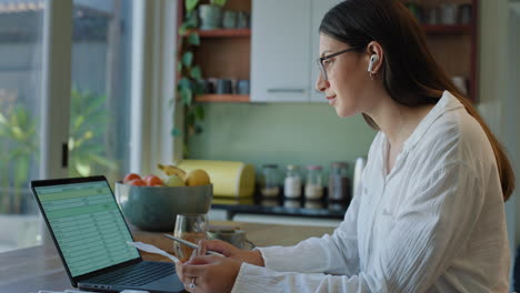 Remote-work,-laptop-and-woman-with-documents