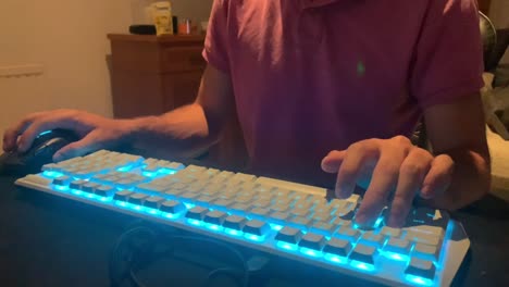 man using pc mouse and keyboard at desk