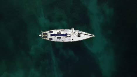 sailing yacht at anchor in the caribbean island of antigua