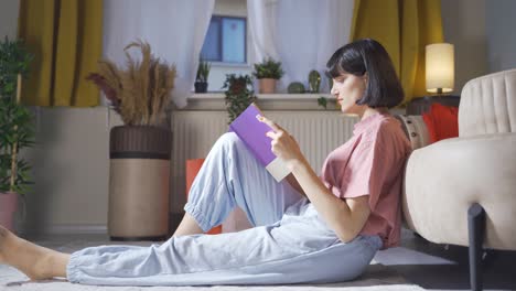 the woman reading the book.