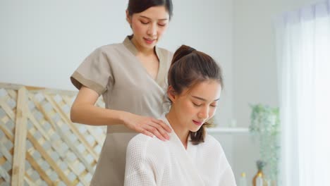 woman receiving a shoulder massage at a spa