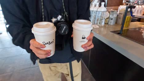 sequence of a coffee handover at a cafe counter