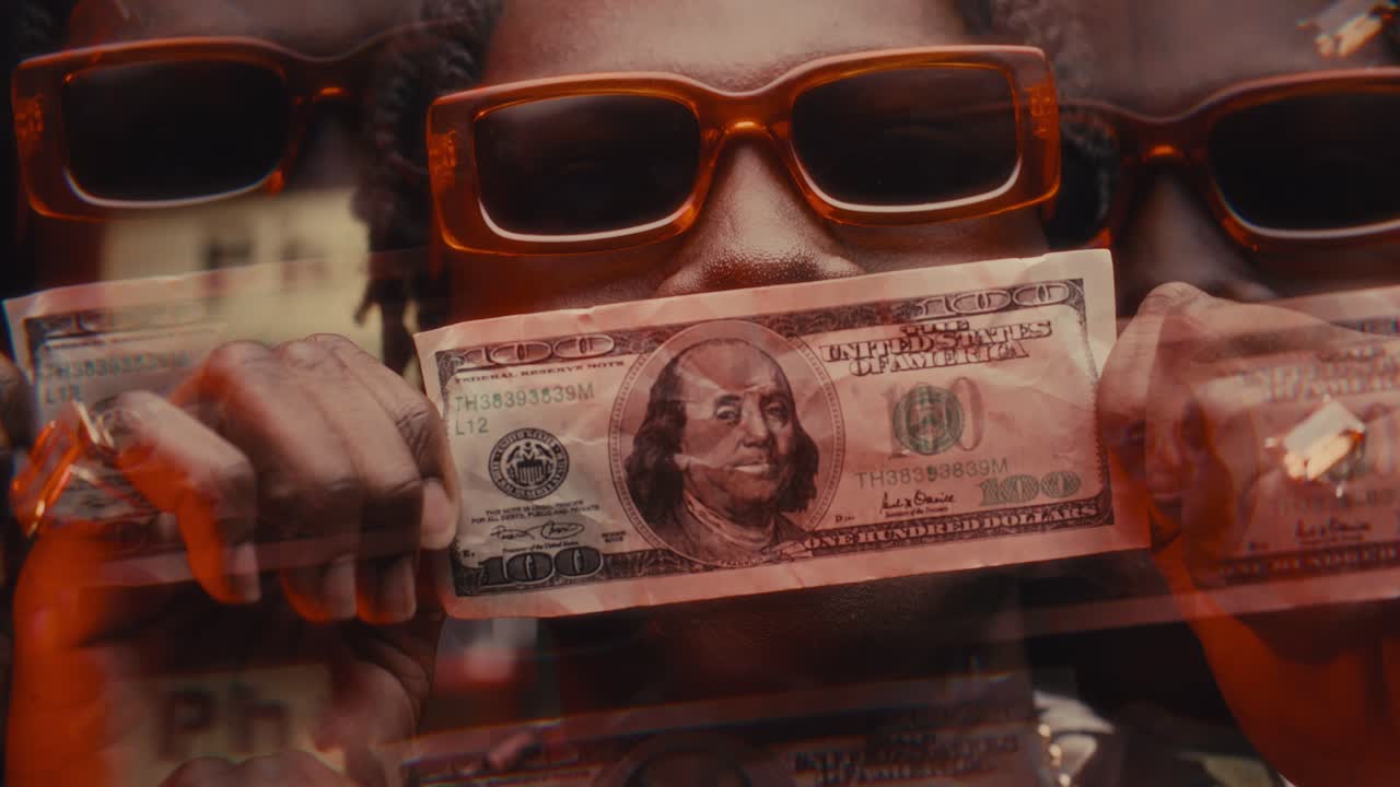 Kaleidoscopic Effect of Black Man in Sunglasses Posing with 100-Dollar Bill