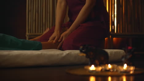 young woman enjoying the acupressure techniques of thai massage. young woman lying down while enjoying the acupressure techniques of traditional thai massage