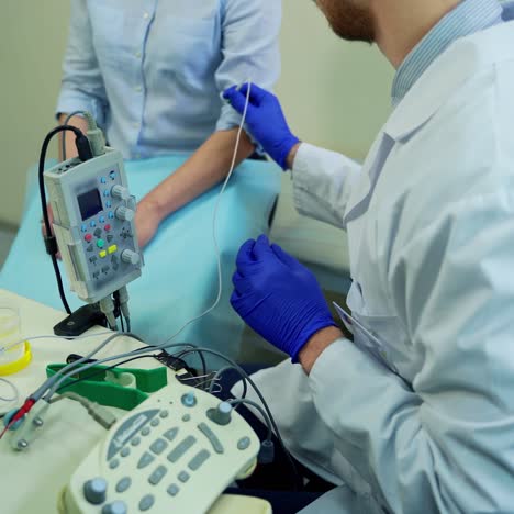 doctor testing female reflexes. male doctor performing neurological tests on female patient
