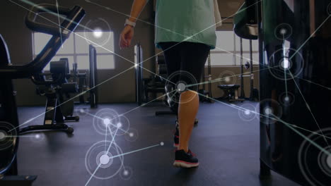 animation of data processing with female disabled athlete with prosthetic leg exercising in bac