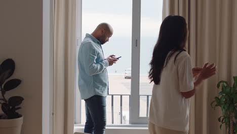 happy young couple in hotel room enjoying vacation getting ready to travel