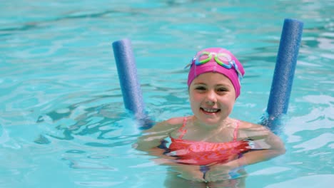 portrait of young girl gesturing in the pool