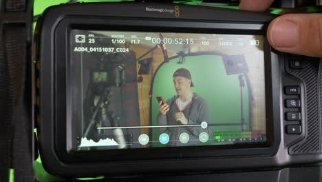 slide in to blackmagic pocket 4k camera, displaying youtuber in home studio